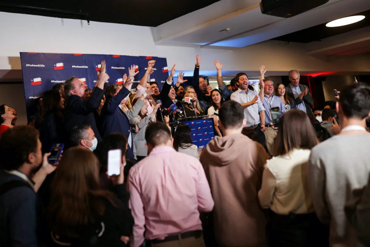 People react to early results of the referendum on a new Chilean constitution in Santiago, Chile, on Sept. 4, 2022. (Pablo Sanhueza/Reuters)