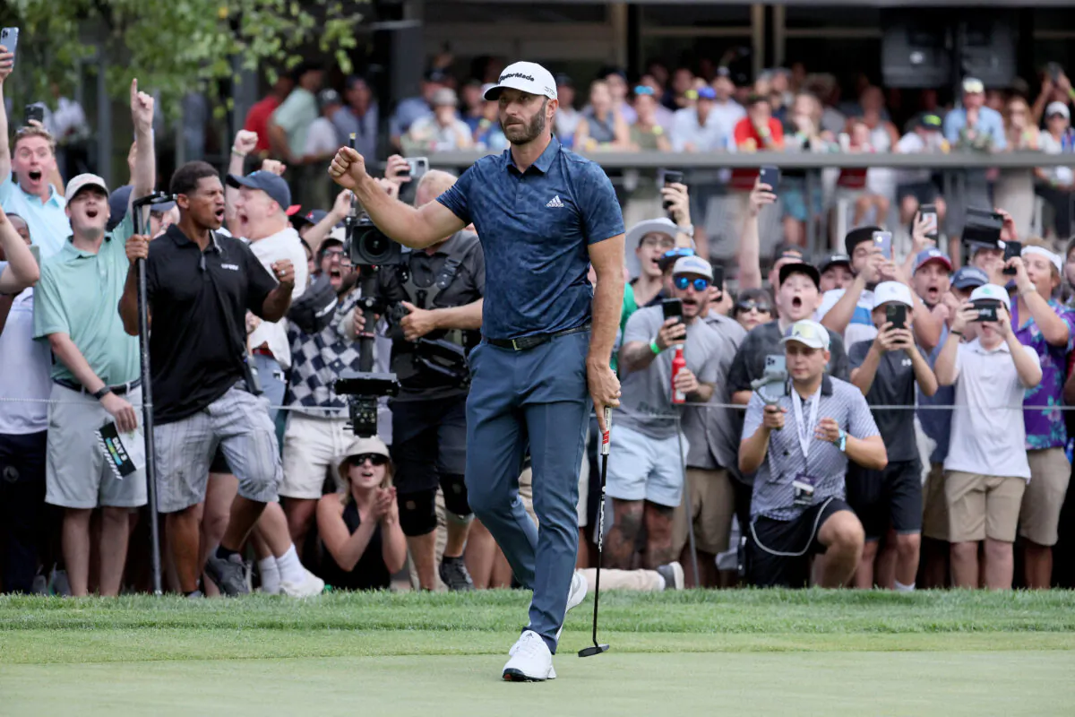 Dustin Johnson of the the United States celebrates after after winning the LIV Golf Invitational—Boston at The Oaks golf course at The International
in Bolton, Mass., on Sept. 4, 2022. (Andy Lyons/Getty Images)