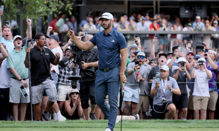 Dustin Johnson of the the United States celebrates after after winning the LIV Golf Invitational—Boston at The Oaks golf course at The International
in Bolton, Mass., on Sept. 4, 2022. (Andy Lyons/Getty Images)
