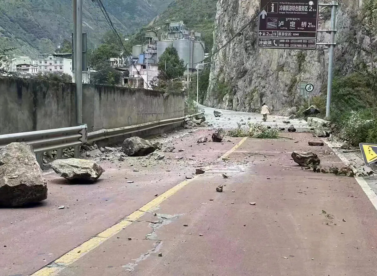 Fallen rocks on a road near Lengqi Town in Luding County of southwest China's Sichuan Province on Sept. 5, 2022. (Xinhua agent via AP)
