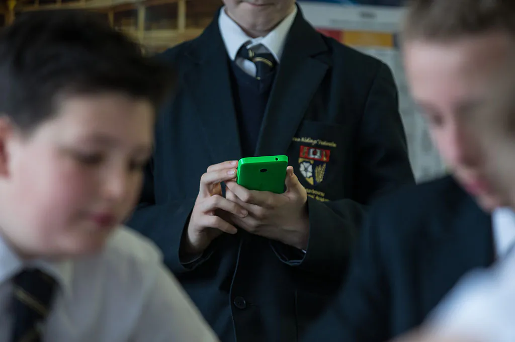 A student uses his mobile phone for research during a english lesson at the Ridings Federation Winterbourne International Academy in South Gloucestershire, England, on Feb. 26, 2015. (Matt Cardy/Getty Images)