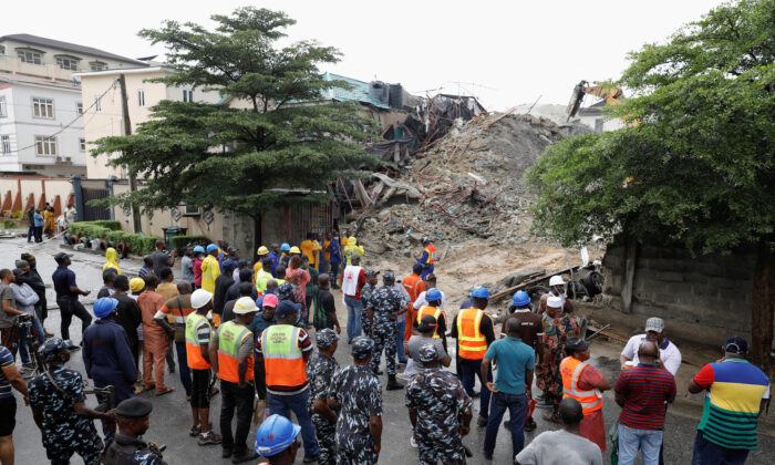 Rescue workers and security personnel gather at the site of an under-construction building collapse in Oniru, Lagos, Nigeria, on Sept. 4, 2022. (Temilade Adelaja/Reuters)