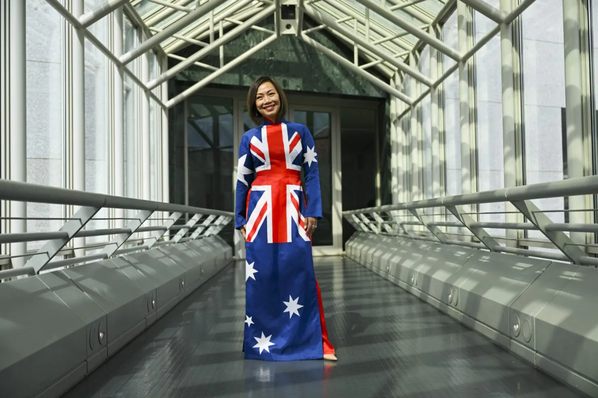 Independent MP for Fowler Dai Le poses for photographs in her Australian flag inspired dress after delivering her first speech in the House of Representatives at Parliament House in Canberra, Monday, September 5, 2022. (AAP Image/Lukas Coch) 