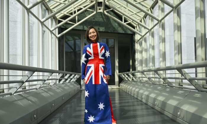 Independent MP for Fowler Dai Le poses for photographs in her Australian flag inspired dress after delivering her first speech in the House of Representatives at Parliament House in Canberra, Monday, September 5, 2022. (AAP Image/Lukas Coch) 