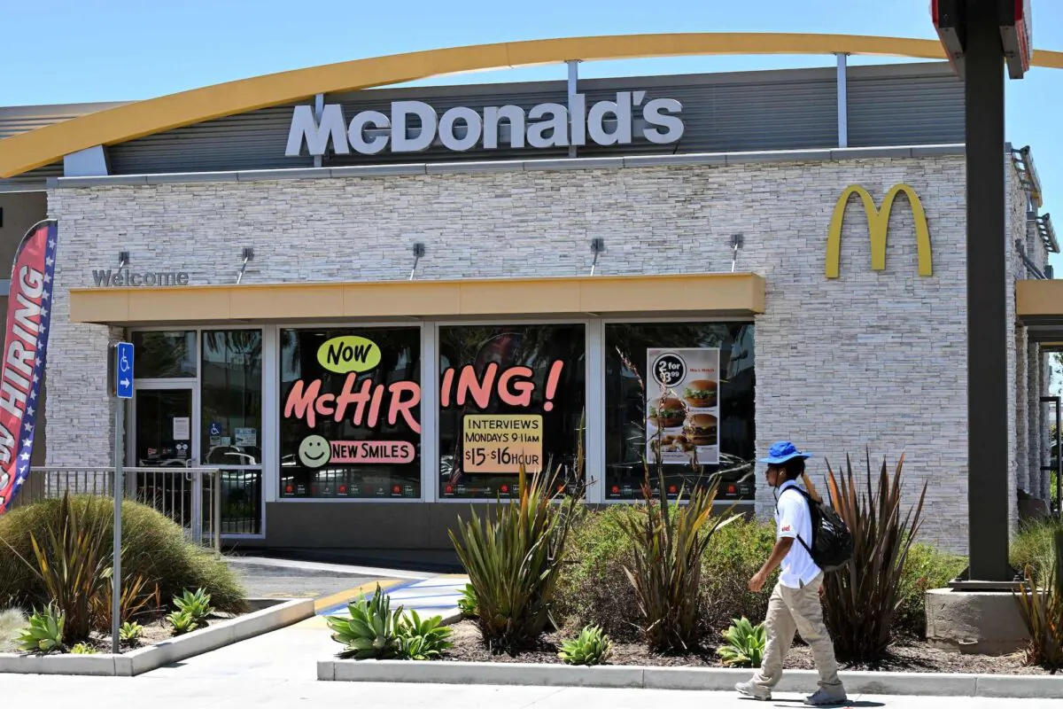 A man walks past a 'Hiring' sign at a McDonald's restaurant in Garden Grove, Calif., on July 8, 2022. (Robyn Beck/AFP via Getty Images)