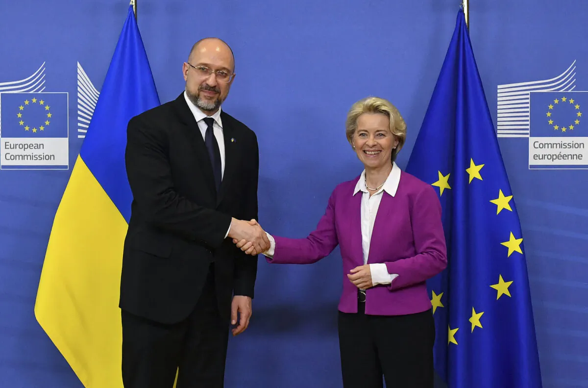 Ukraine's Prime Minister Denys Schmyhal (L) is welcomed by European Commission president Ursula Von der Leyen prior to their bilateral meeting at the EU headquarters in Brussels, on Sept. 05, 2022. (John Thys/AFP via Getty Images)