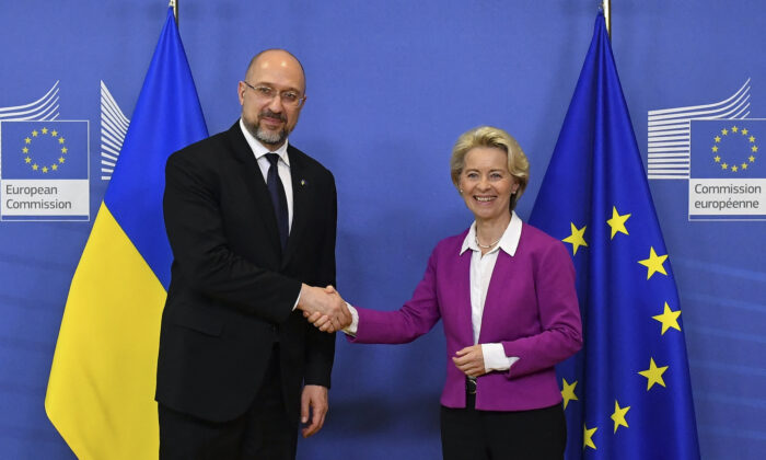 Ukraine's Prime Minister Denys Schmyhal (L) is welcomed by European Commission president Ursula Von der Leyen prior to their bilateral meeting at the EU headquarters in Brussels, on Sept. 05, 2022. (John Thys/AFP via Getty Images)