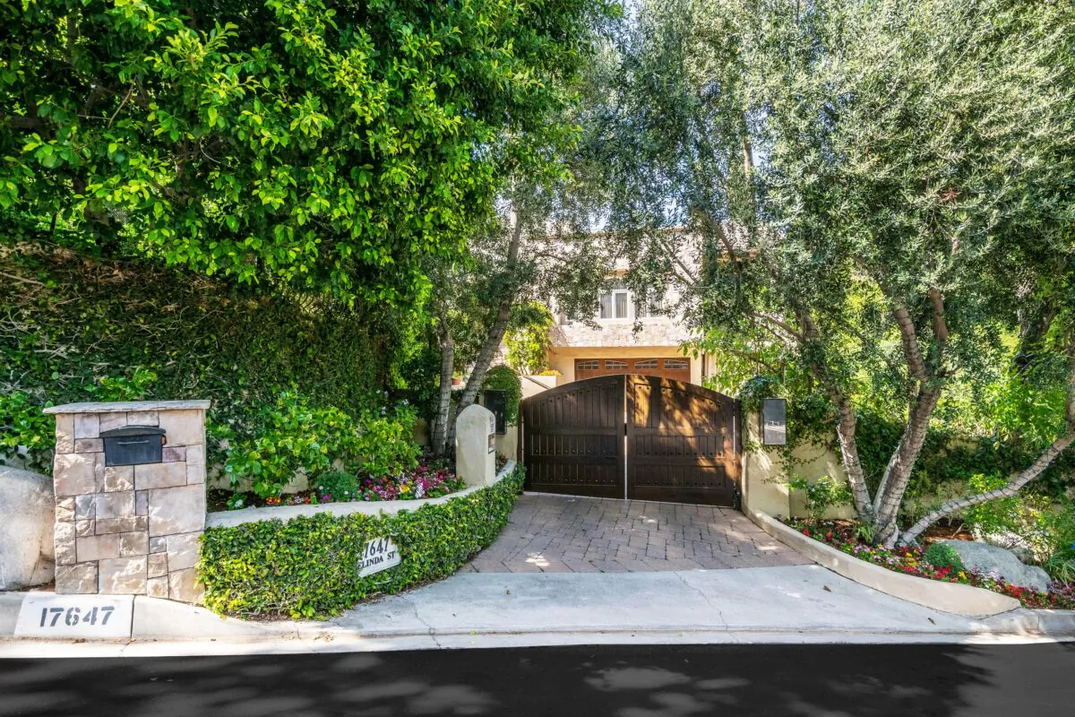 This classic contemporary/Mediterranean home sits on nearly half an acre of manicured grounds set behind private gates within Encino's coveted Rancho Estates. (Jade Mills)
