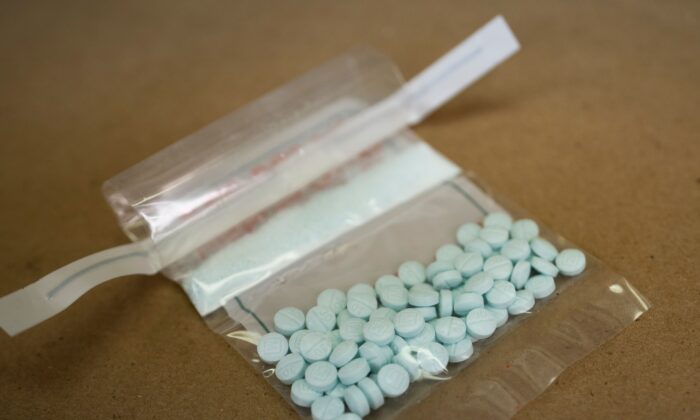 Tablets believed to beryllium  laced with fentanyl are displayed astatine  the Drug Enforcement Administration Northeast Regional Laboratory successful  New York connected  Oct. 8, 2019. (Don Emmert/AFP via Getty Images)