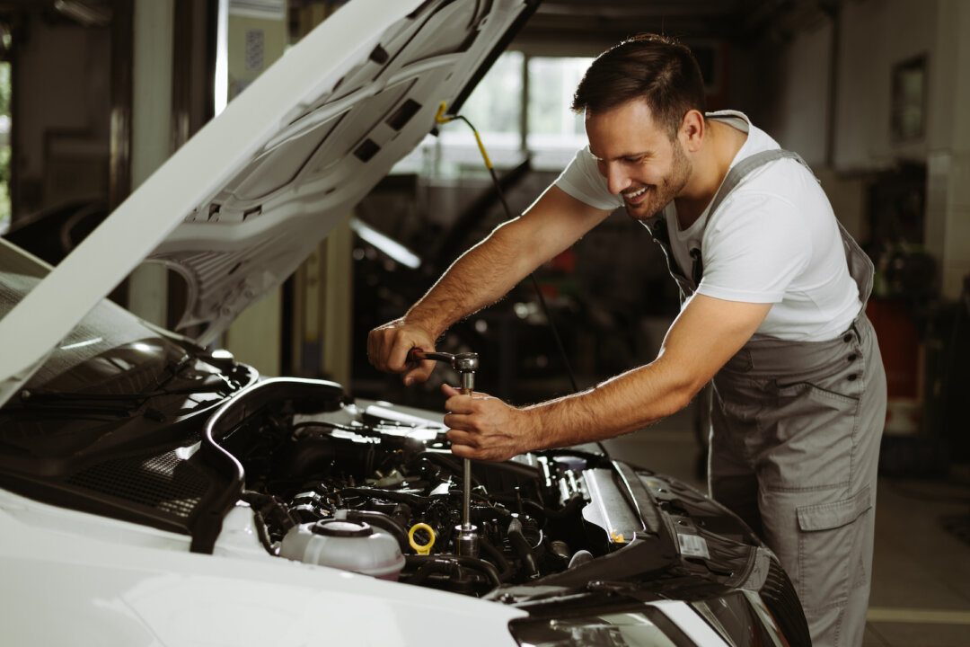 The best-paid side hustle in Canada is a mechanic, which can earn you an extra $35 per hour (goksi/Shutterstock)