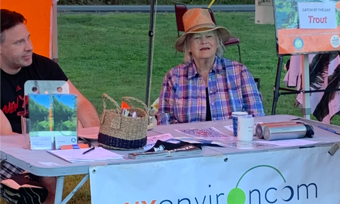 Grace Woodard (R), founder of the unregistered group Deerpark Rural Alliance, and Alex Scilla (L) at the Mamakating Farmers Market in Wurtsboro, N.Y., on Sept. 2, 2022. Scilla, who has close ties to China, has been using his New Paltz-based group NYEnvironcom to fund Woodard's group.