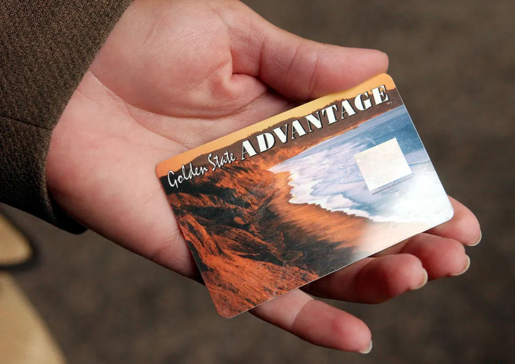 A person holds a sample of the new California State Electronic Benefit Transfer (EBT) card in Oakland, Calif. on July 17, 2002. (Justin Sullivan/Getty Images)