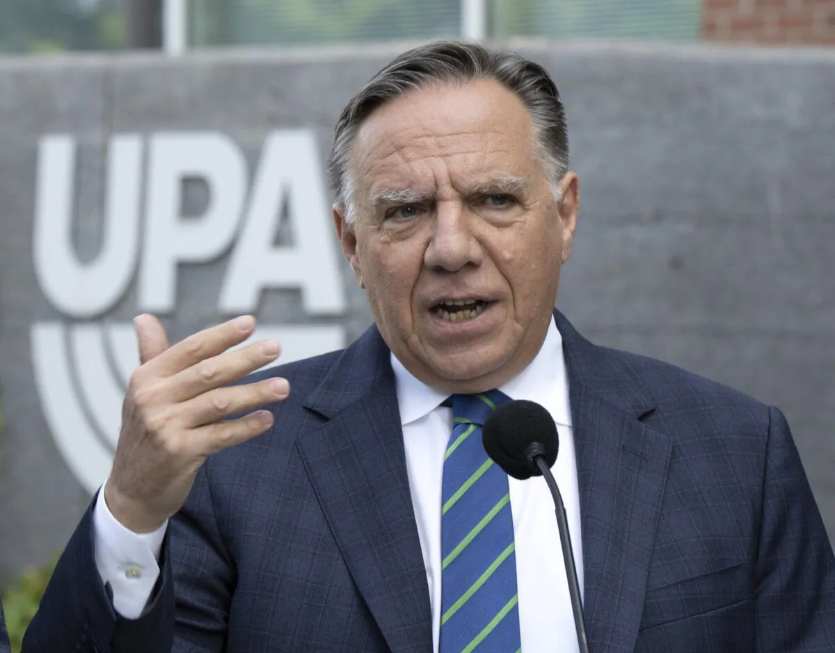 Coalition Avenir Québec Leader François Legault speaks to reporters while campaigning Sept. 7, 2022 outside Montreal. (The Canadian Press/Ryan Remiorz)