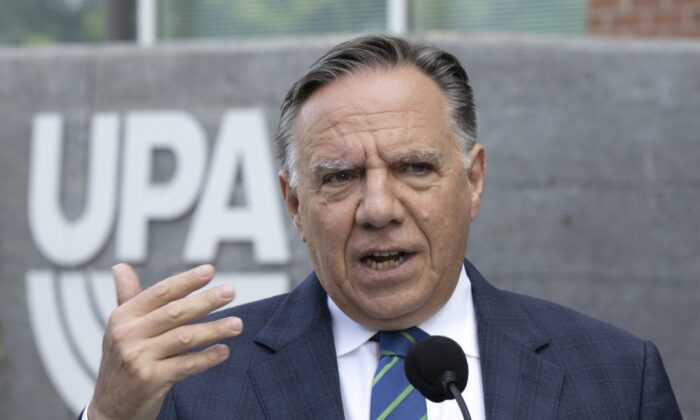 Coalition Avenir Québec Leader François Legault speaks to reporters while campaigning Sept. 7, 2022 outside Montreal. (The Canadian Press/Ryan Remiorz)