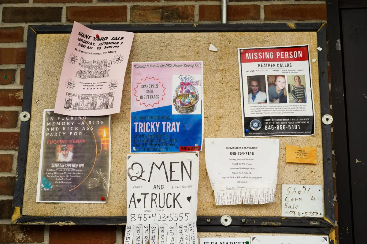 A missing person poster of Heather Callas is seen on a community board outside a gas station in Cuddebackville, N.Y., on Sept. 5, 2022. (Cara Ding/The Epoch Times)