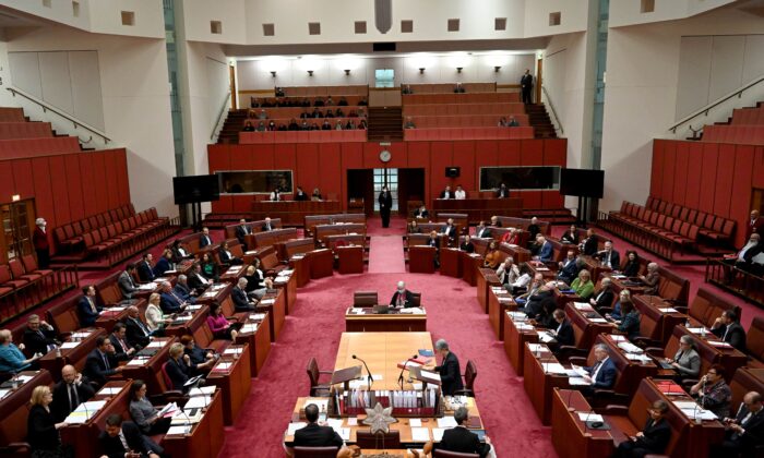 Senators divide during the vote for the Climate Change Bill in the Australian Senate chamber at Parliament House in Canberra, Australia on Sept. 8, 2022. (AAP Image/Mick Tsikas) 