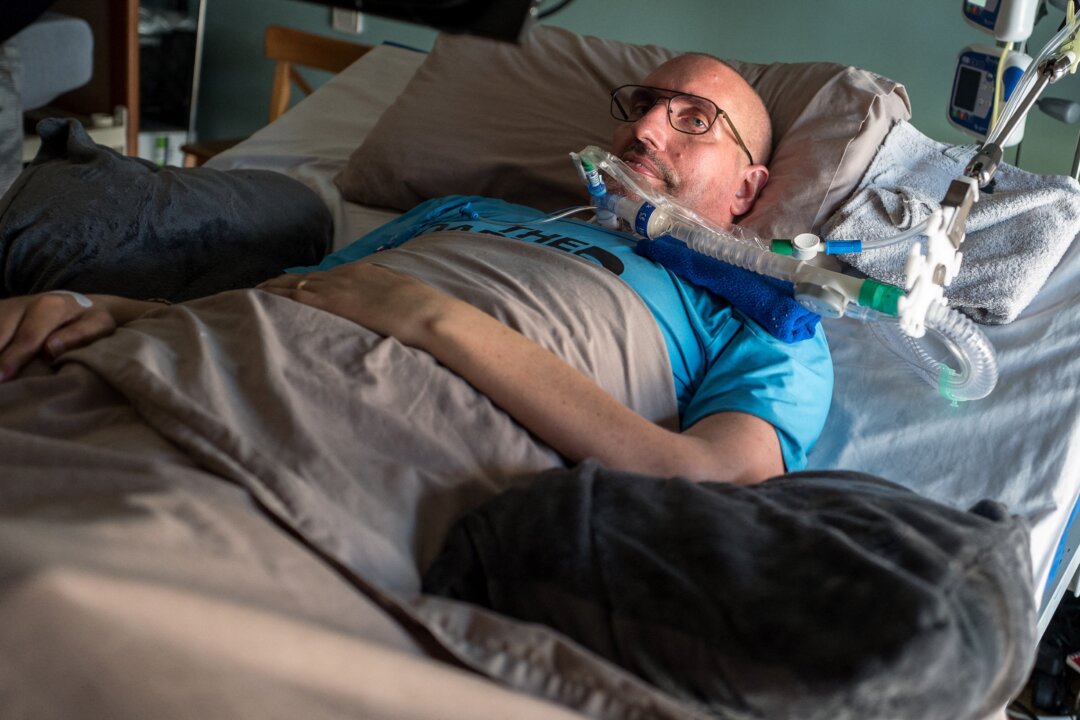 Guilhem Gallart, known as Pone, lies on a bedat his home in Gaillac in the south of France on June 16, 2021. Since 2015, he suffers from amyotrophic lateral sclerosis. (FRED SCHEIBER/AFP via Getty Images)