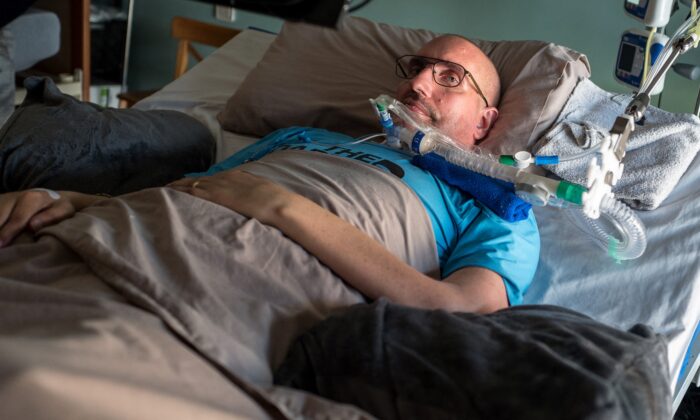 Guilhem Gallart, known as Pone, lies on a bedat his home in Gaillac in the south of France on June 16, 2021. Since 2015, he suffers from amyotrophic lateral sclerosis. (FRED SCHEIBER/AFP via Getty Images)