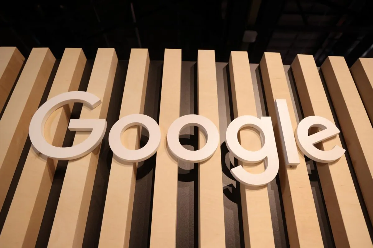 A wooden Google logo hangs at a stand at the 2022 Re:publica digital society festival in Berlin, Germany, on June 9, 2022. (Sean Gallup/Getty Images)