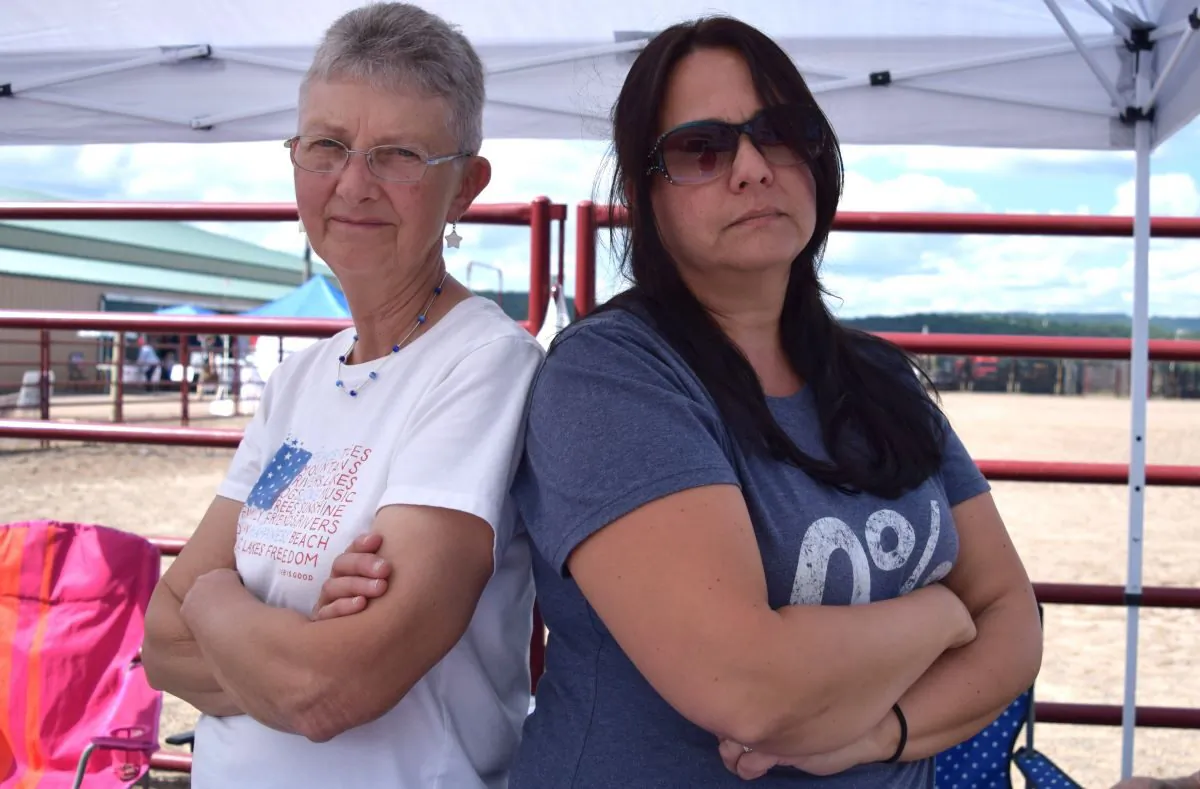 After being prosecuted for refusing to wear masks at a local school board meeting, Elaine Barnhart (L) and Katherine Detwiler collected donations to help with their legal fees at a patriotic political gathering in Columbia County, Pa., on Aug. 27, 2022. (Beth Brelje/The Epoch Times)