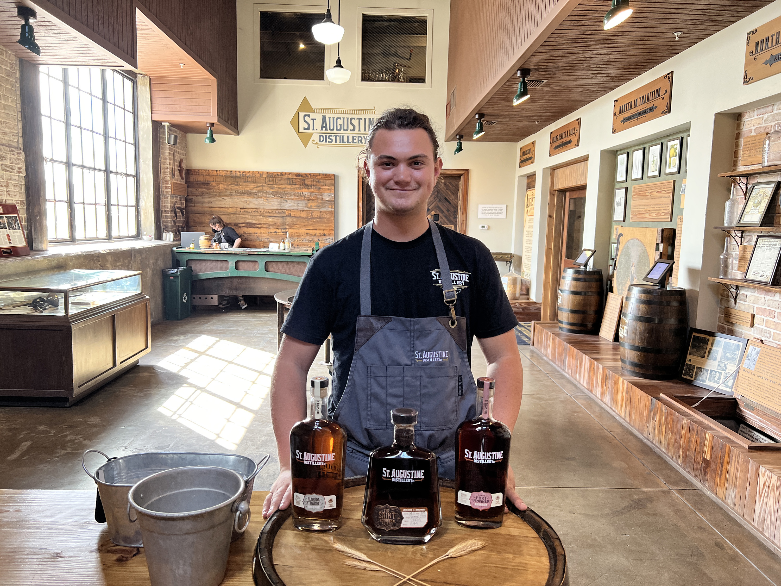 Former tour guide Cole Lacaze welcoming guests into the St. Augustine Distillery distillery