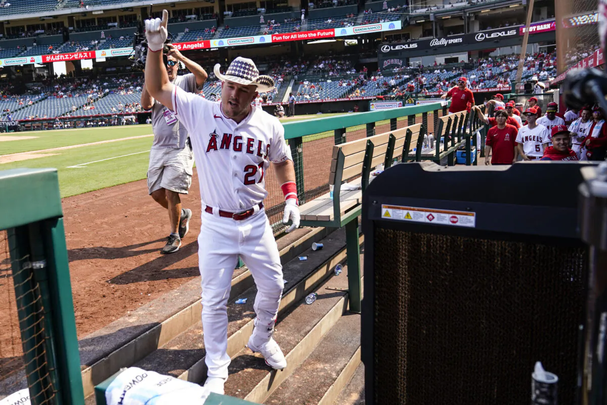 Los Angeles Angels center fielder Mike Trout (27) celebrates in the dugout after hitting a home run during the fifth inning of a baseball game against the Detroit Tigers in Anaheim, Calif., on Sept. 7, 2022. (Ashley Landis/AP Photo)