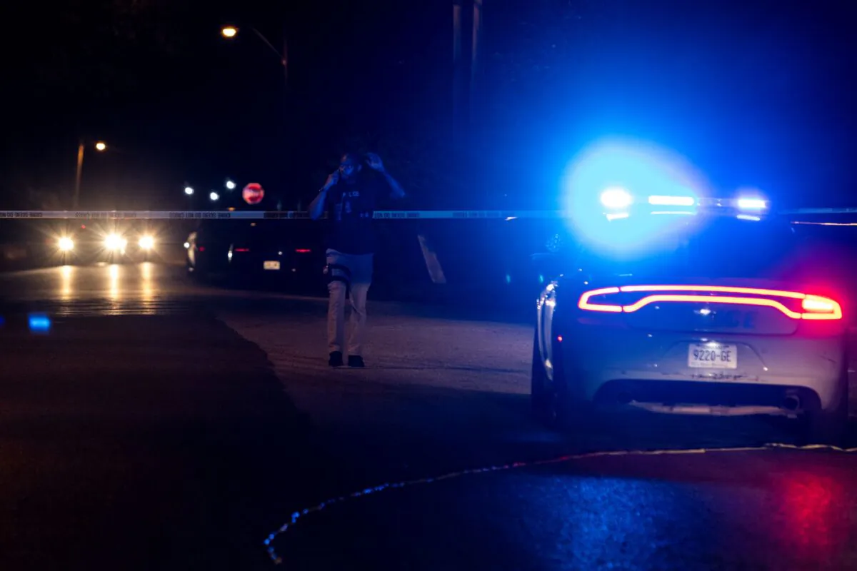 A police officer investigates at the scene where a man was taken into custody following a series of shootings throughout the city of Memphis, Tenn., on Sept. 7, 2022. (Brad Vest/Getty Images)