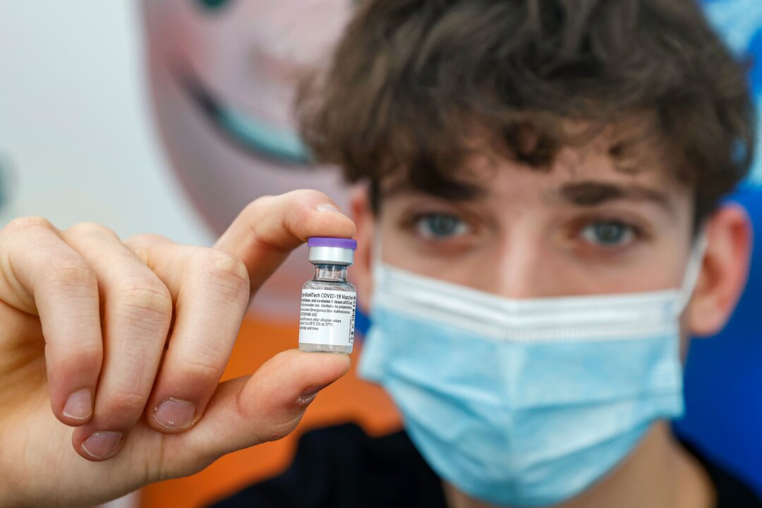 A 16-year-old receives a dose of the Pfizer-BioNtech COVID-19 vaccine at Clalit Health Services, in Israel's Mediterranean coastal city of Tel Aviv on Jan. 23, 2021. (Jack Guez/AFP via Getty Images)