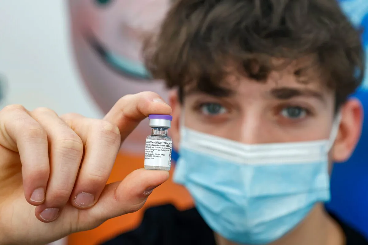 A 16-year-old teenager receives a dose of the Pfizer-BioNtech COVID-19 vaccine at Clalit Health Services, in Israel's Mediterranean coastal city of Tel Aviv on Jan. 23, 2021. (Jack Guez/AFP via Getty Images)