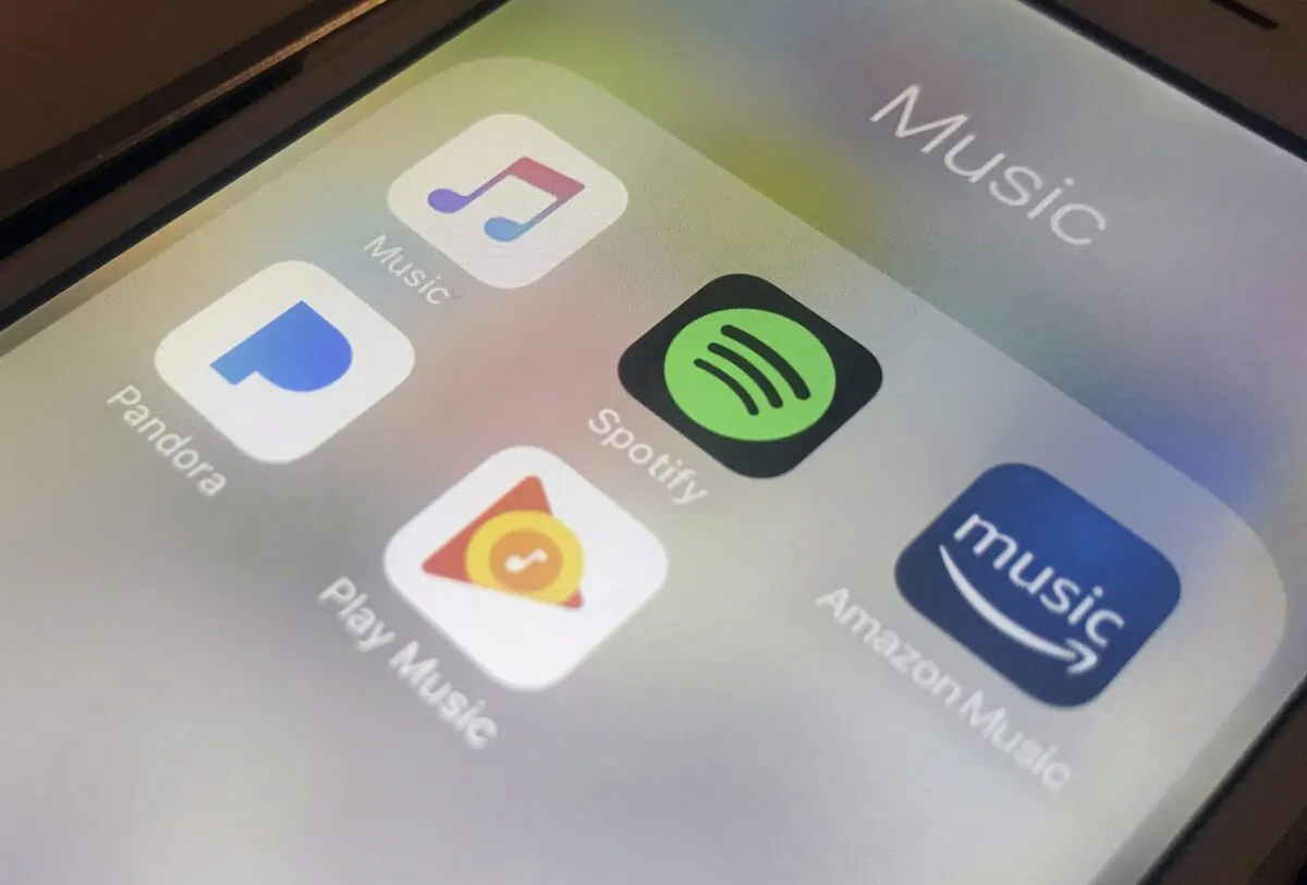 Music streaming apps clockwise from top left, Apple, Spotify, Amazon, Pandora, and Google on an iPhone are seen in a file photo taken in New York on Jan. 28, 2018. (AP Photo/Jenny Kane)