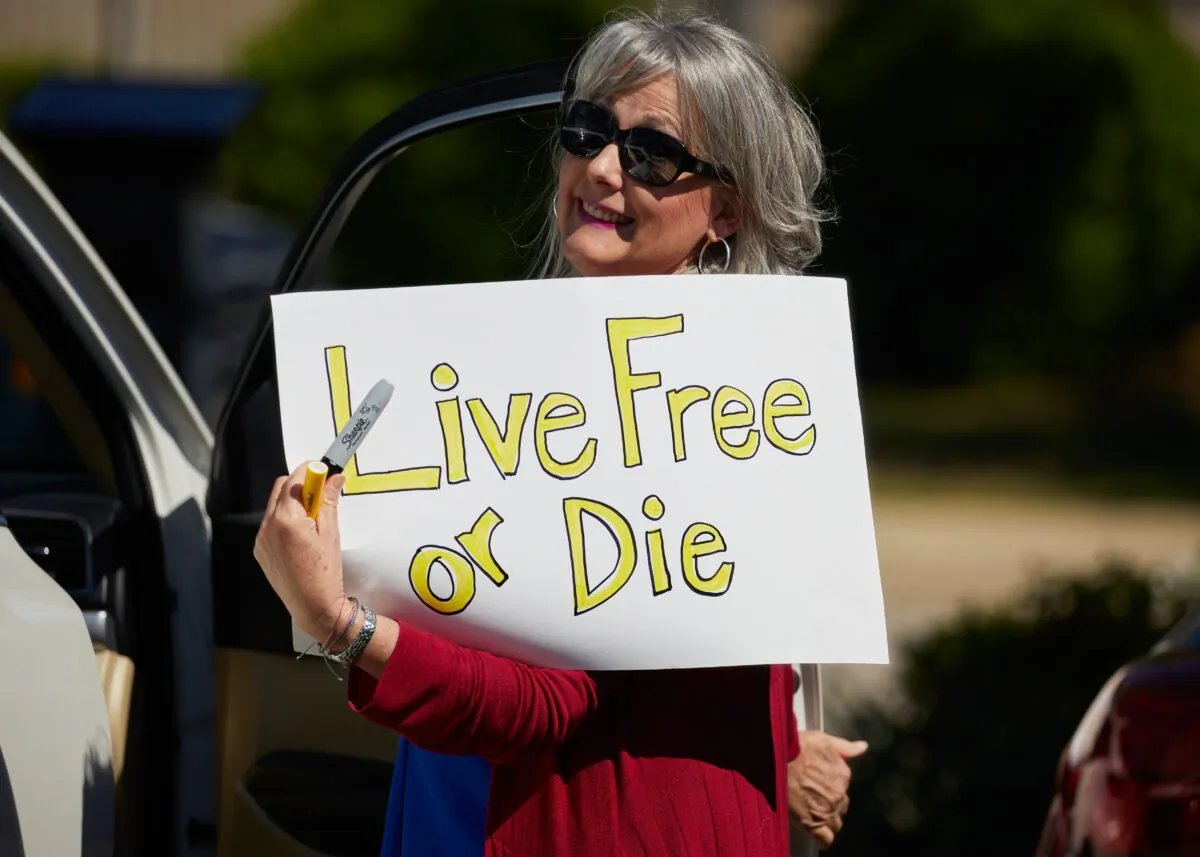Protesters demonstrate against the coronavirus lockdown at a parking lot adjacent to the North Carolina State Legislature in Raleigh, N.C., on April 14, 2020. (Logan Cyrus/AFP via Getty Images)