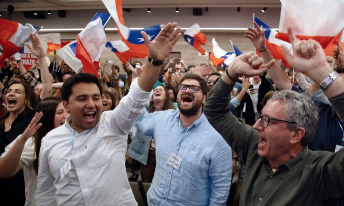People rejecting the new constitution draft react after learning the first results of the referendum vote, in Santiago, Chile, on Sept. 4, 2022. (Claudio Reyes/AFP via Getty Images)