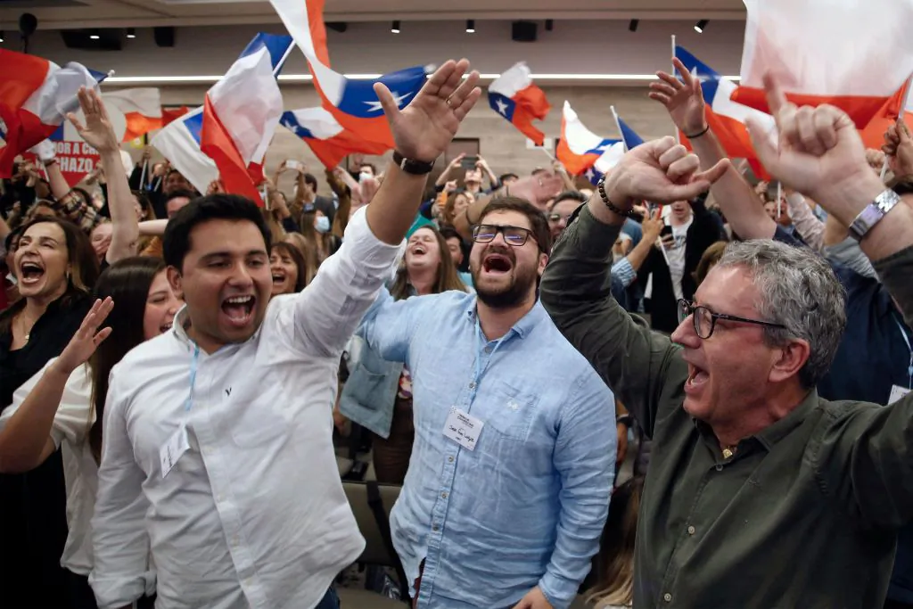 People rejecting the new constitution draft react after learning the first results of the referendum vote, in Santiago, Chile, on Sept. 4, 2022. (Claudio Reyes/AFP via Getty Images)