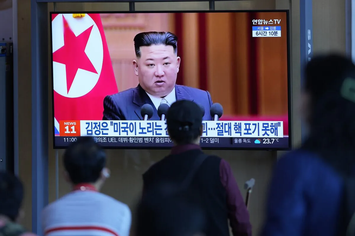 People watch a TV screen showing a news program reporting with file footage of North Korean leader Kim Jong Un at the Seoul Railway Station in Seoul, South Korea, on Sept. 9, 2022. (Lee Jin-man/AP Photo)