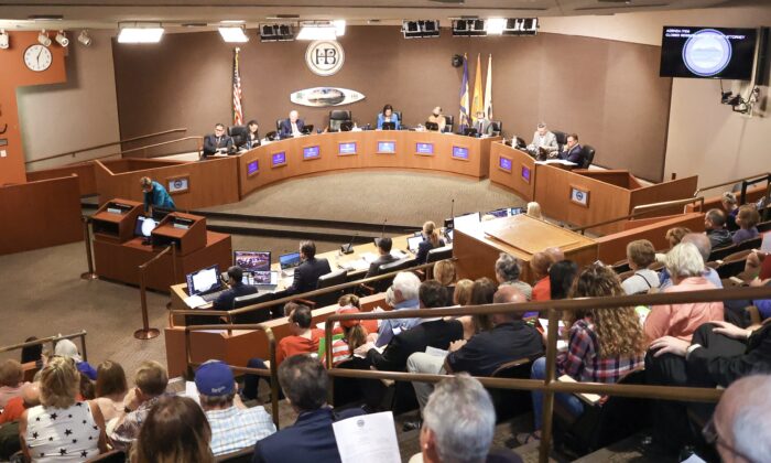 Residents attend a Huntington Beach City Council meeting in Huntington Beach, Calif., on July 19, 2022. (Julianne Foster/The Epoch Times)