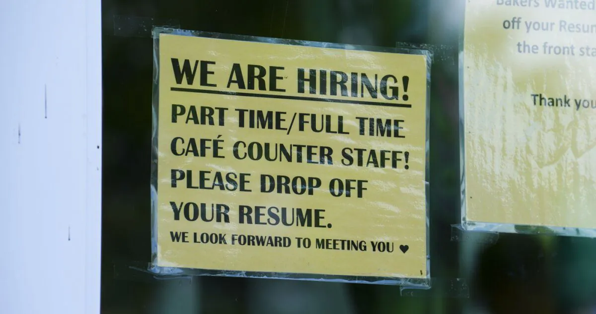 A sign for help wanted is pictured in a business window in Ottawa on July 12, 2022. (The Canadian Press/Sean Kilpatrick)