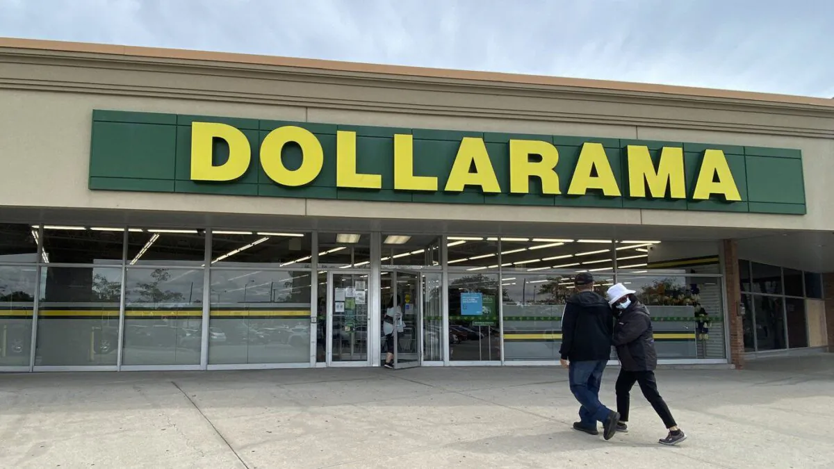 People walk into a Dollarama store in Toronto, September 25, 2021. (The Canadian Press/Graeme Roy)