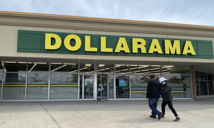 People walk into a Dollarama store in Toronto, September 25, 2021. (The Canadian Press/Graeme Roy)