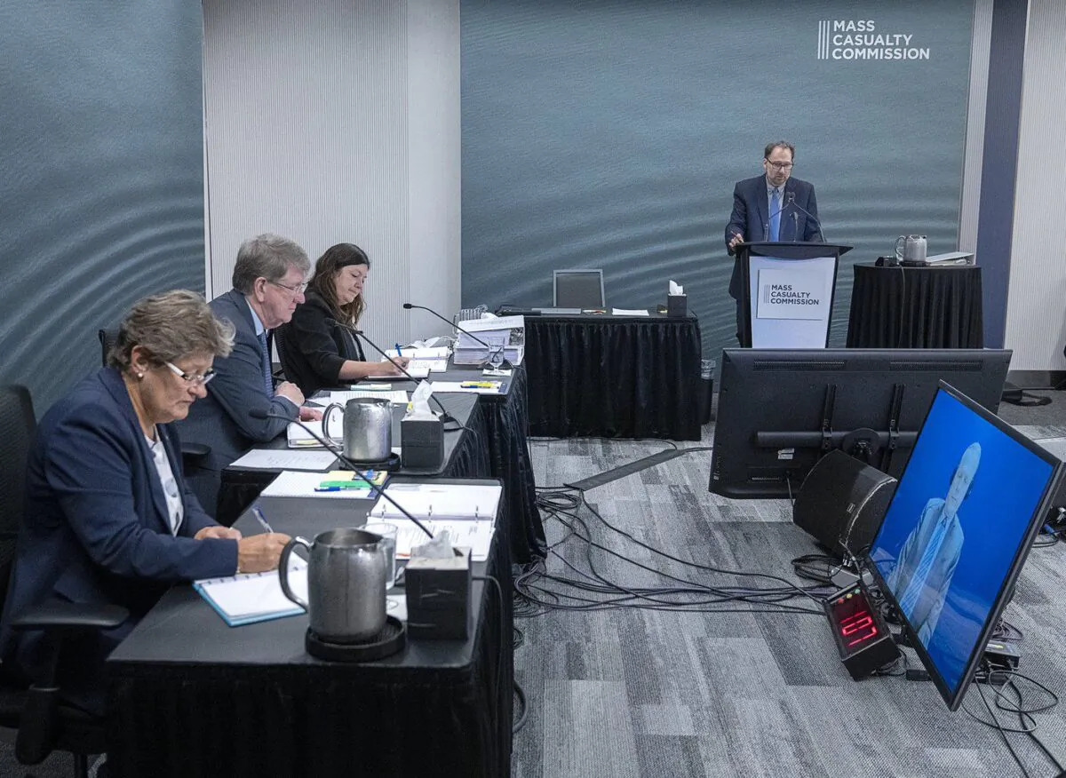 Commissioners Leanne Fitch, Michael MacDonald, chair, and Kim Stanton, left to right, appearing by video at the Mass Casualty Commission inquiry into the mass murders in rural Nova Scotia on April 18/19, 2020, in Halifax on Sept. 9, 2022. (The Canadian Press/Andrew Vaughan)