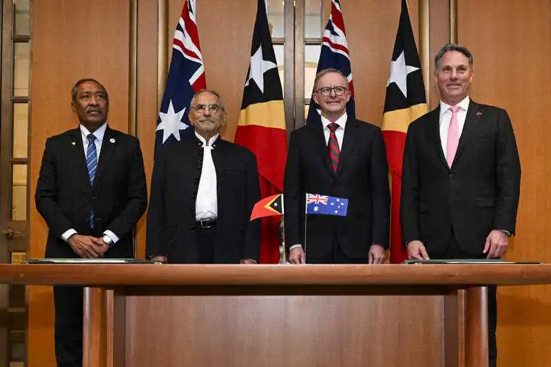 (L-R) Timor-Leste Minister for Defence, Filomeno Paixão de Jesus, President of Timor-Leste José Ramos-Horta, Australian Prime Minister Anthony Albanese and Australian Defence Minister Richard Marles pose for photographs at the end of a signing ceremony at Parliament House in Canberra, Wednesday, September 7, 2022. Mr Ramos-Horta is in Australia on a 5 day official visit. (AAP Image/Lukas Coch)