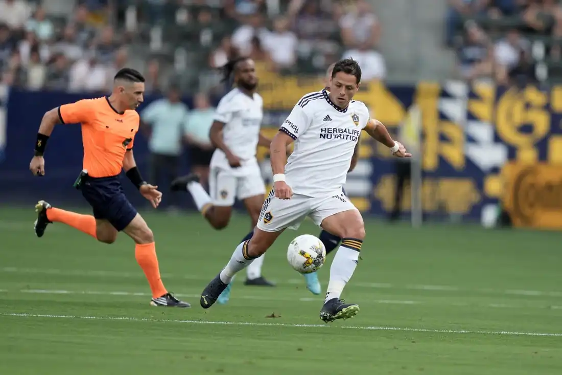 LA Galaxy forward Javier Hernandez (14) kicks the ball against Sporting Kansas City in the first half at Dignity Health Sports Park in Carson, Calif., on Sept. 4, 2022. (Kirby Lee/USA TODAY Sports)