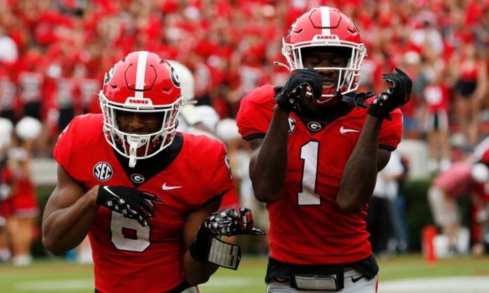Georgia running back Kenny McIntosh (6) celebrates with Georgia wide receiver Marcus Rosemy-Jacksaint (1) after scoring touchdown during the first half of a college football game between Samford and Georgia in Athens, Ga., on  Sept. 10, 2022.(Syndication Online Athens via Field Level Media)