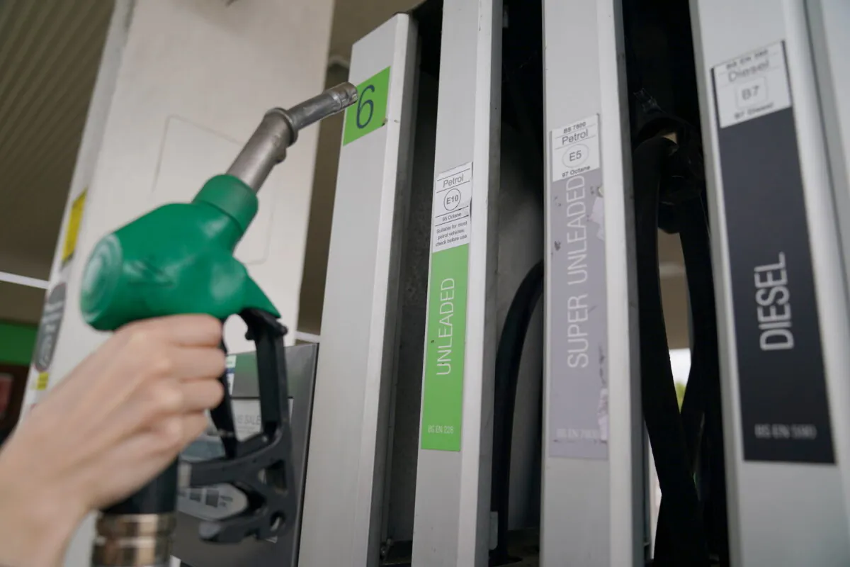 Undated photo showing a person taking a pump at a petrol station. (Joe Giddens/PA Media)