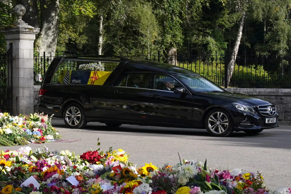 The hearse carrying the coffin of Queen Elizabeth leaves Balmoral Castle, Scotland, on Sept. 11, 2022 (Owen Humphreys/PA Media)
