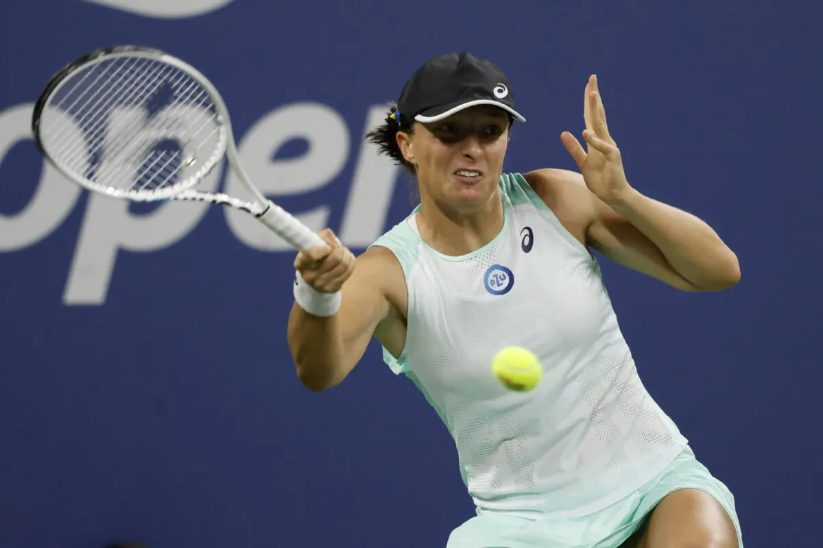 Iga Swiatek, of Poland, returns a shot to Lauren Davis, of the United States, during the third round of the U.S. Open tennis championships in New York on Sept. 3, 2022. (Jason DeCrow/ AP Photo)