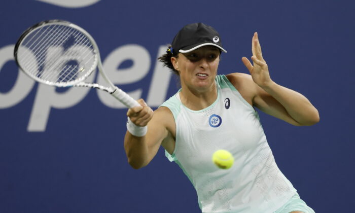 Iga Swiatek, of Poland, returns a shot to Lauren Davis, of the United States, during the third round of the U.S. Open tennis championships in New York on Sept. 3, 2022. (Jason DeCrow/ AP Photo)