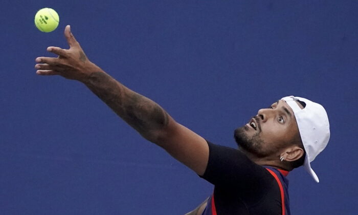 Nick Kyrgios, of Australia, serves to Benjamin Bonzi, of France, during the second round of the US Open tennis championships in New York, Aug. 31, 2022. (John Minchillo/AP Photo)
