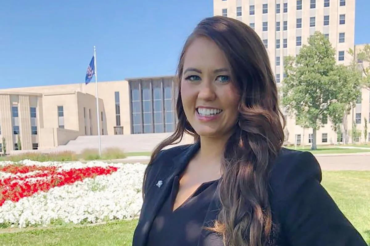 Cara Mund poses for a photo in front of the state Capitol in Bismarck, N.D., on Aug. 10, 2022. (James MacPherson/AP Photo)