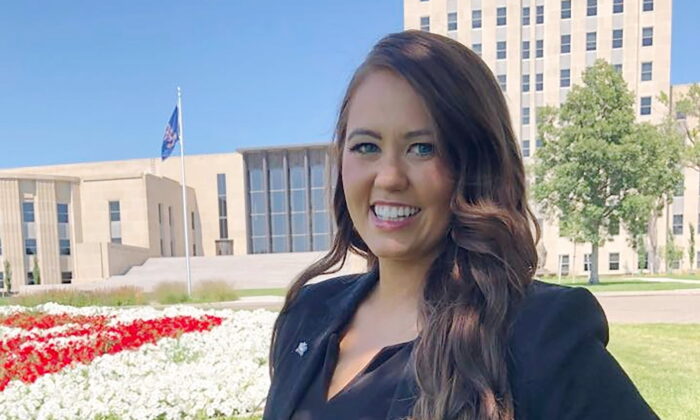 Cara Mund poses for a photo in front of the state Capitol in Bismarck, N.D., on Aug. 10, 2022. (James MacPherson/AP Photo)