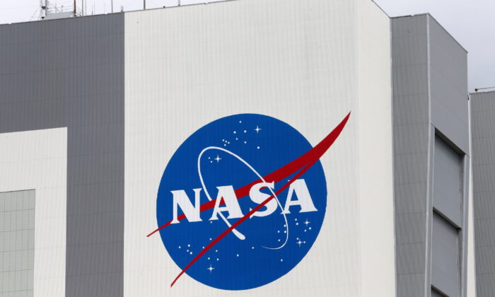 The NASA logo at Kennedy Space Center ahead of the NASA/SpaceX launch of a commercial crew mission to the International Space Station in Cape Canaveral, Fla., on April 16, 2021. (Joe Skipper/Reuters)